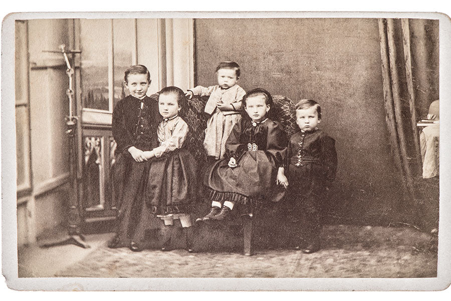 Old family photo with five children