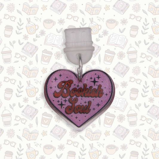 Heart-shaped "Bookish Soul" Kindle charm with purple background and red text, UV resin sealed, for USB C devices.