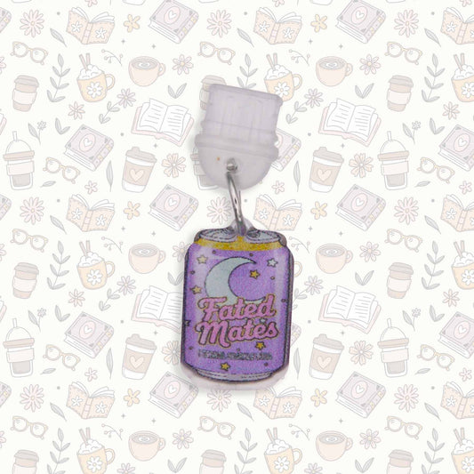 Fated Mate soda can Kindle charm and USB-C dust plug, purple with moon and stars, on bookish background