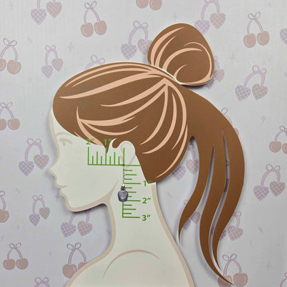Spooky Ghost Potion Bottle Dangle Earring, purple with white ghost and silver hook, shown on a measurement display against a cherry and heart patterned background.