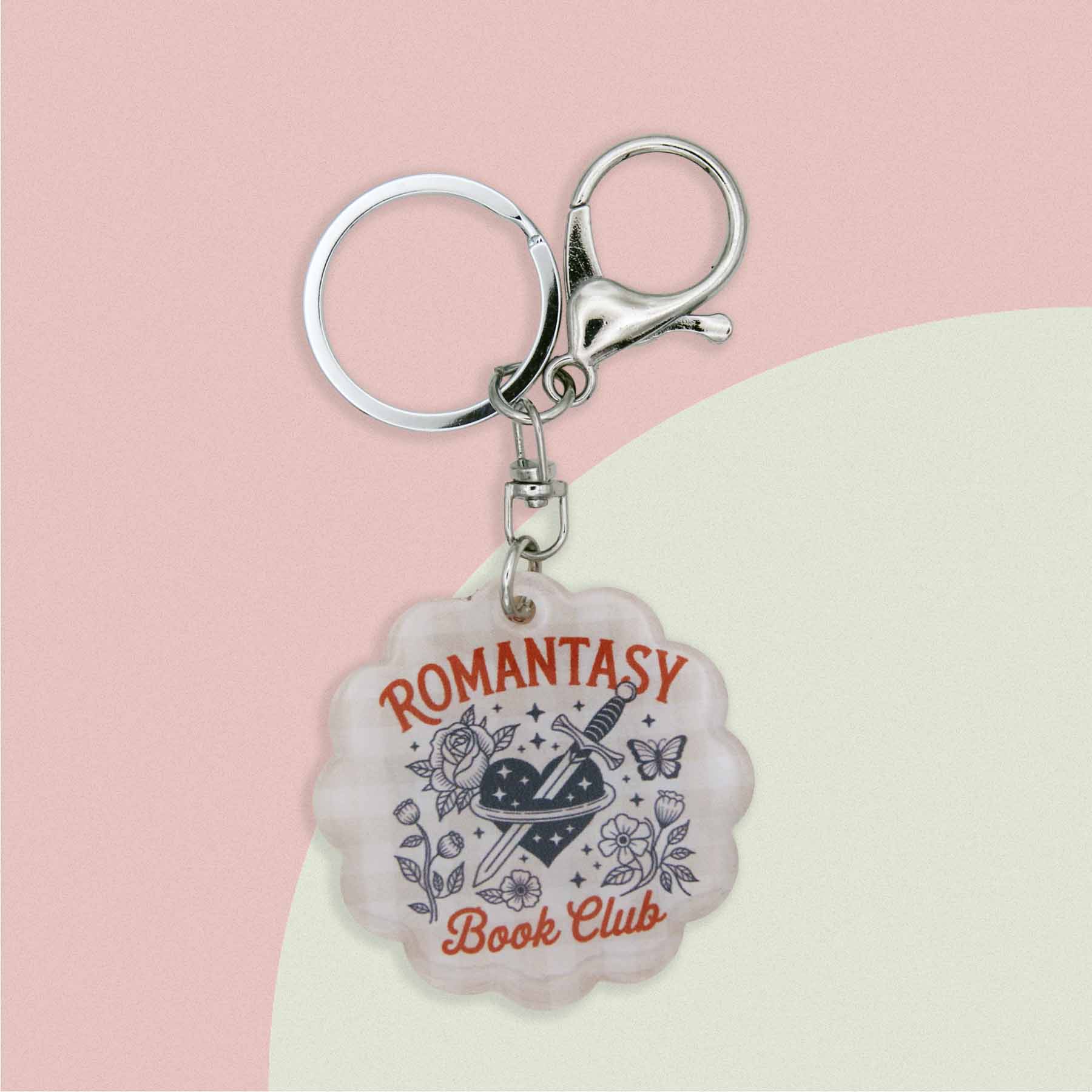 Romantasy Book Club keychain, featuring a heart, dagger, roses, butterfly, and stars design, perfect for readers.